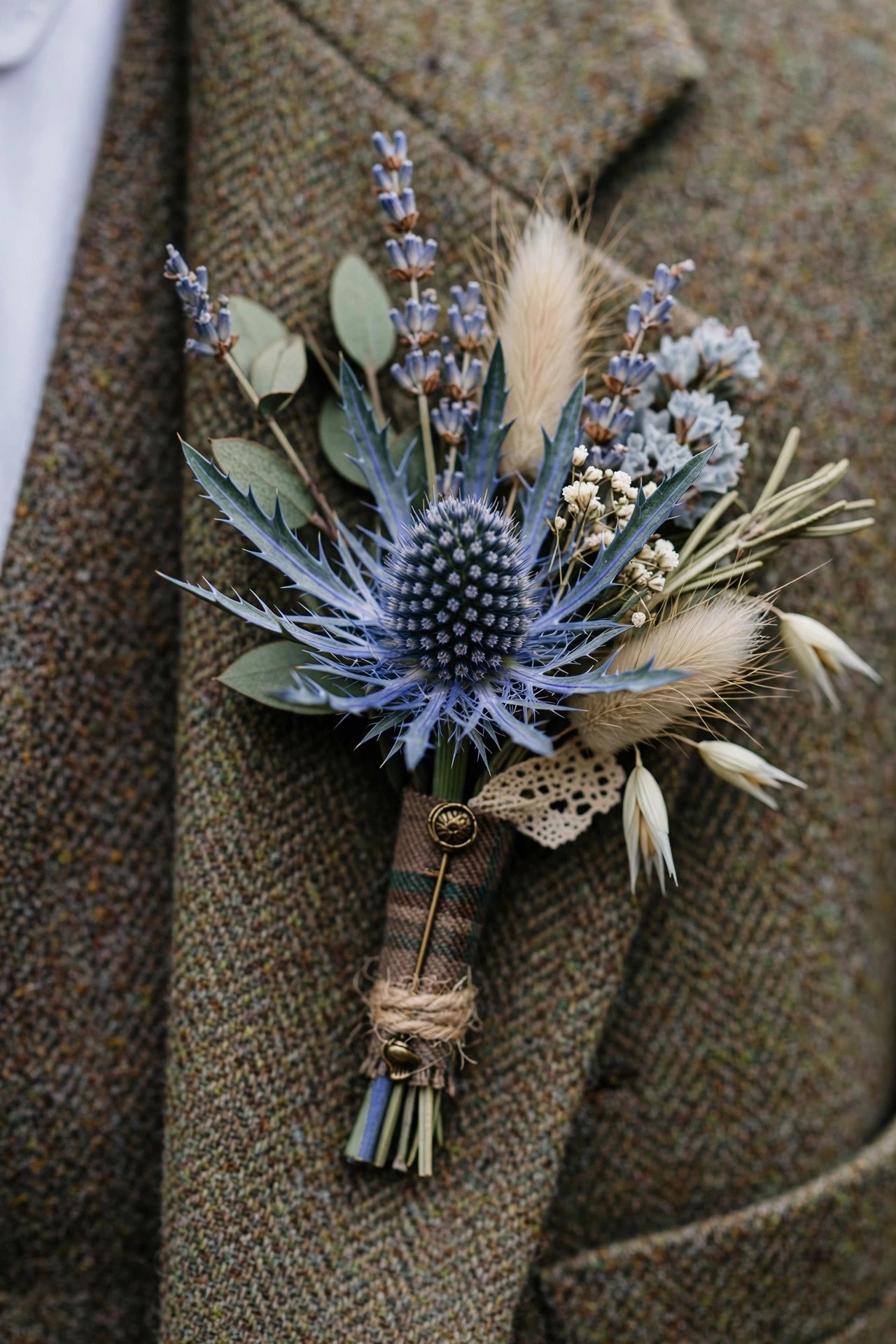 Blue thistle wedding boutonniere with heritage style