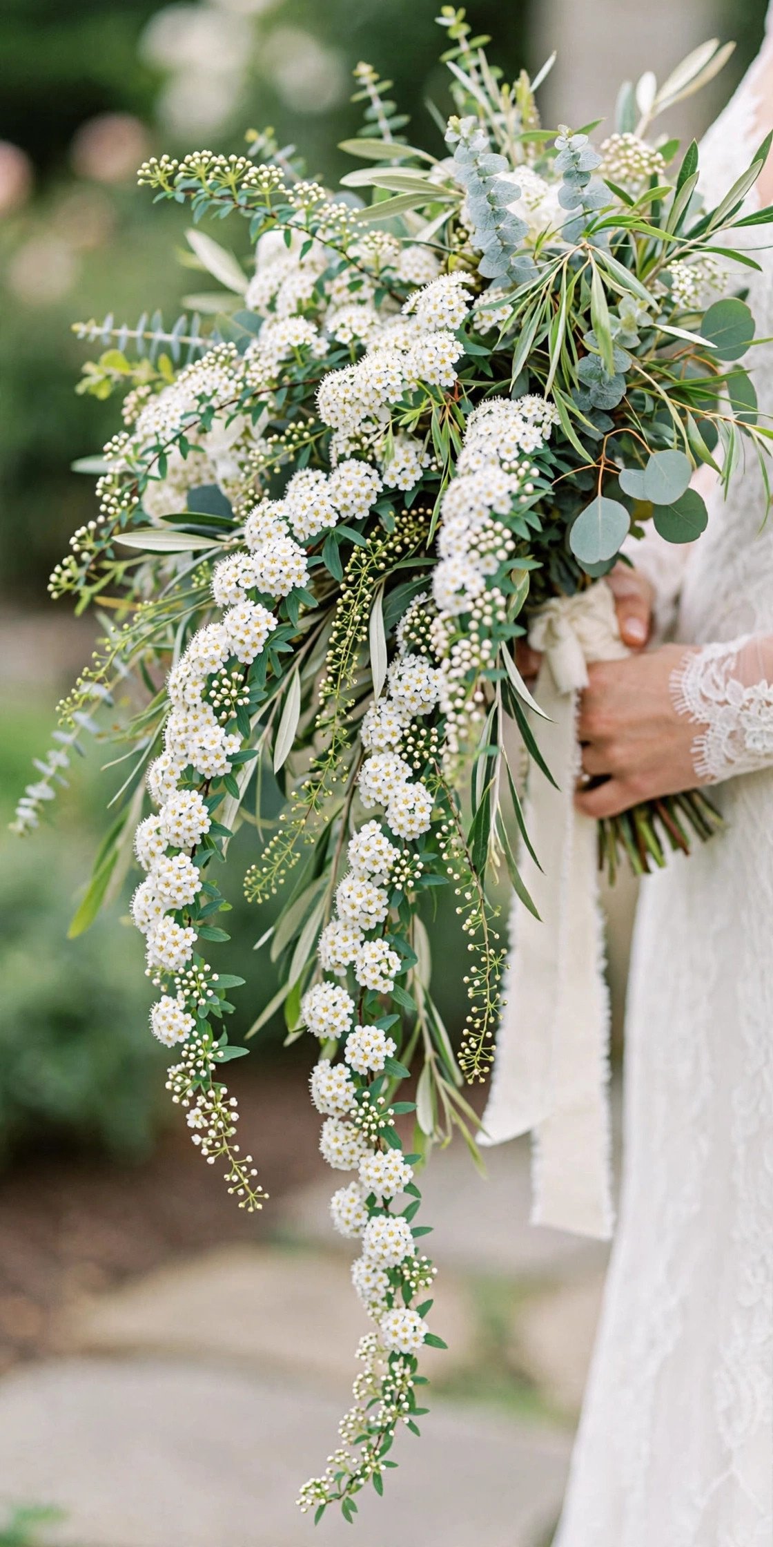 Cascading spirea bridal bouquet with white trailing blooms