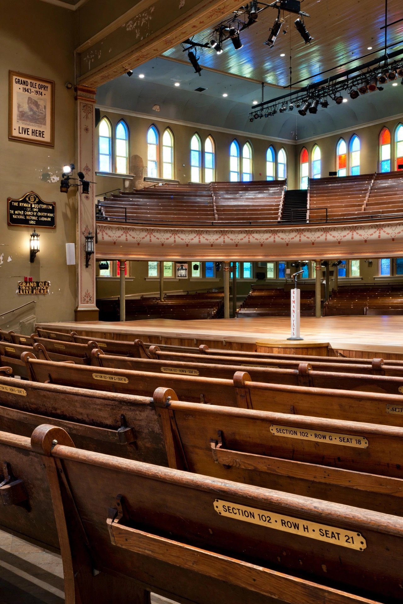 Historic Ryman Auditorium interior with wooden pews