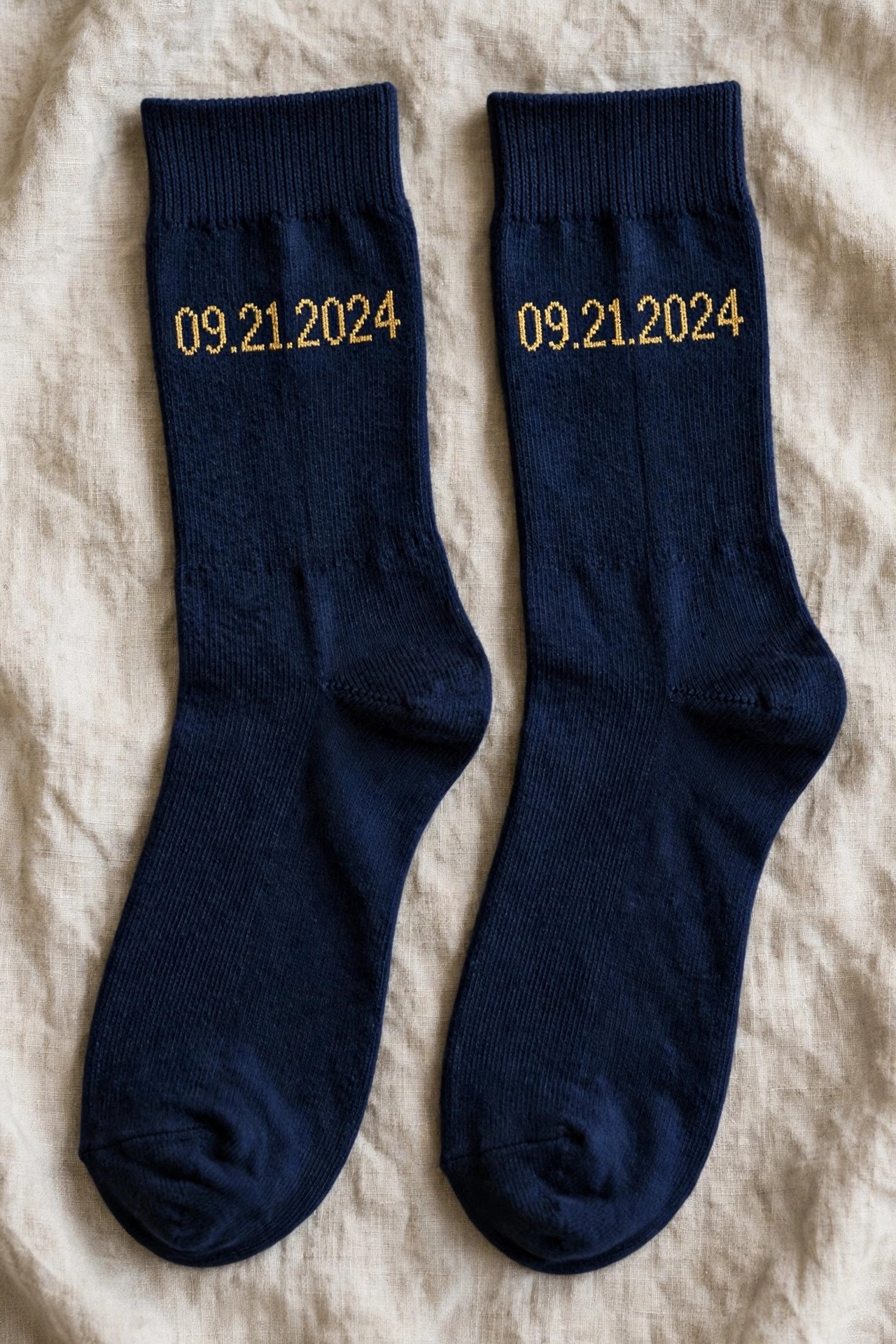 Navy dress socks with wedding date knitted in gold