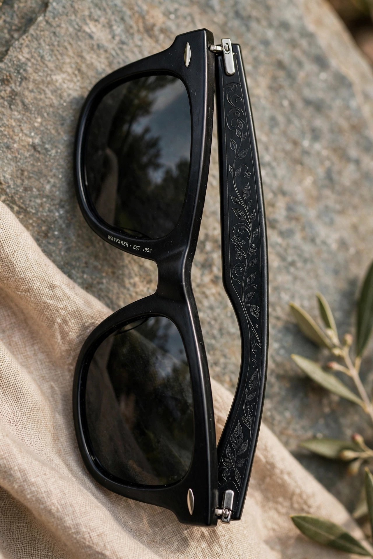 Wayfarer sunglasses with engraved temple arms