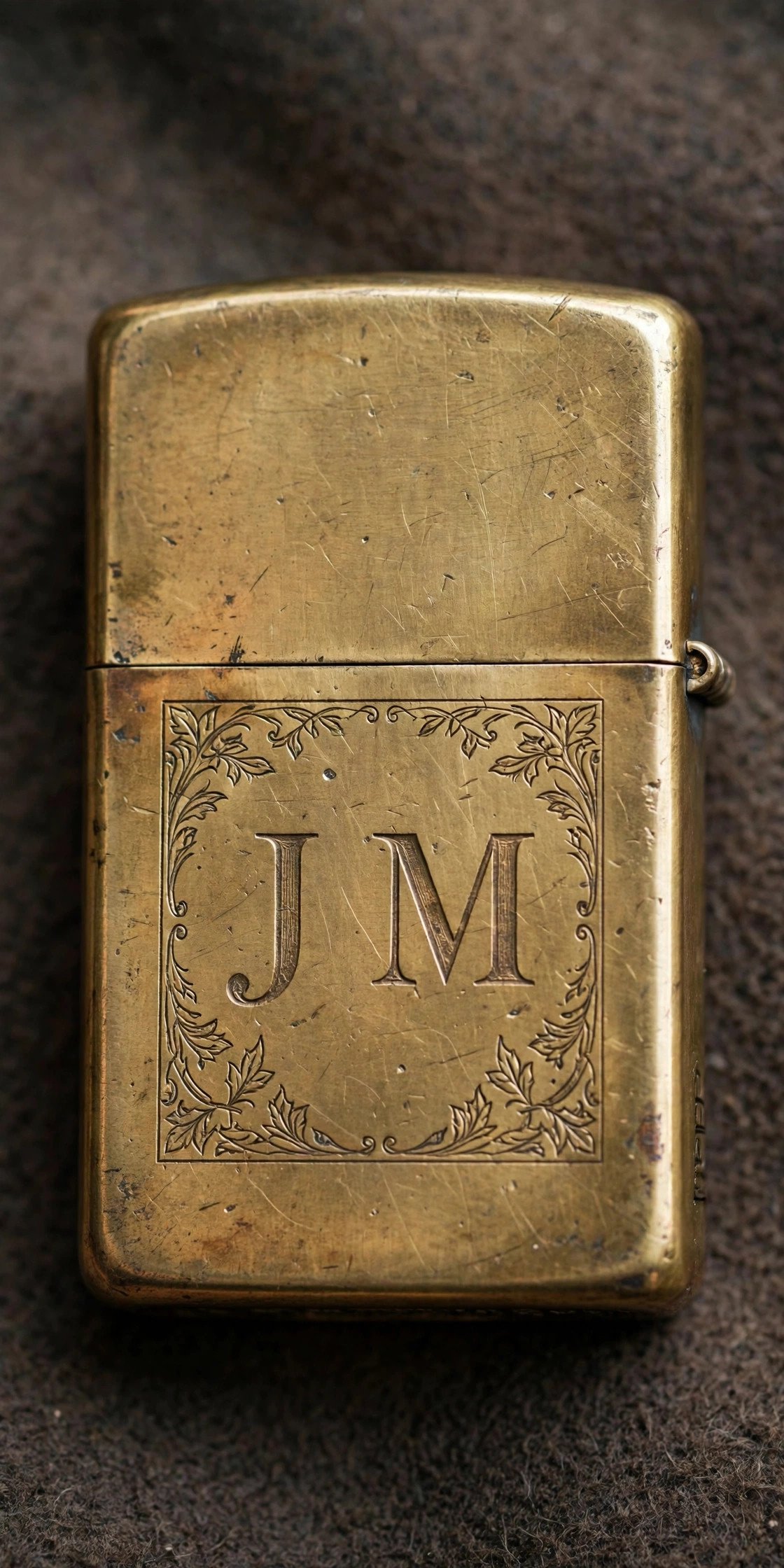 Brass zippo-style lighter engraved with initials