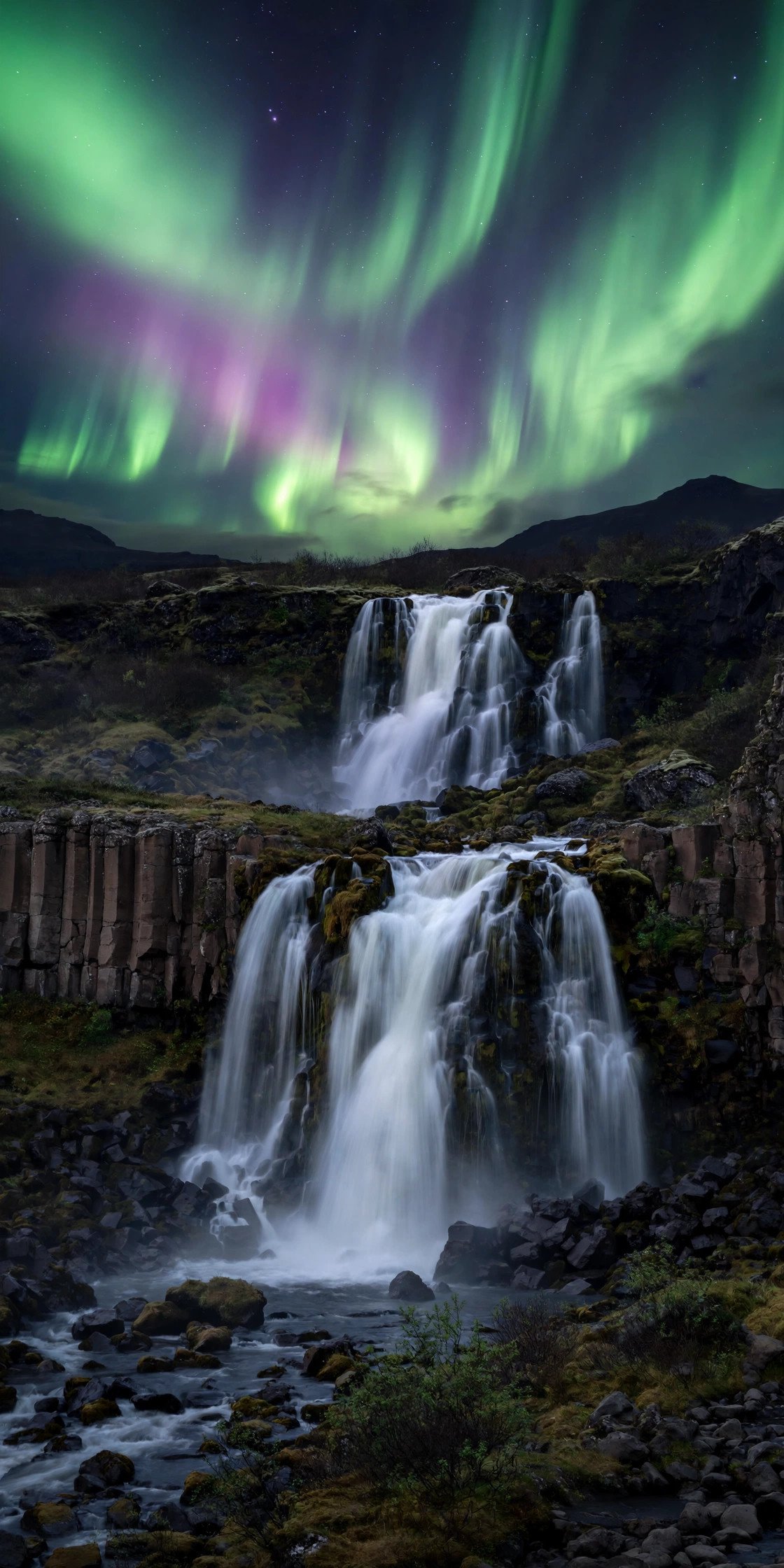 Northern lights over an Icelandic waterfall at night