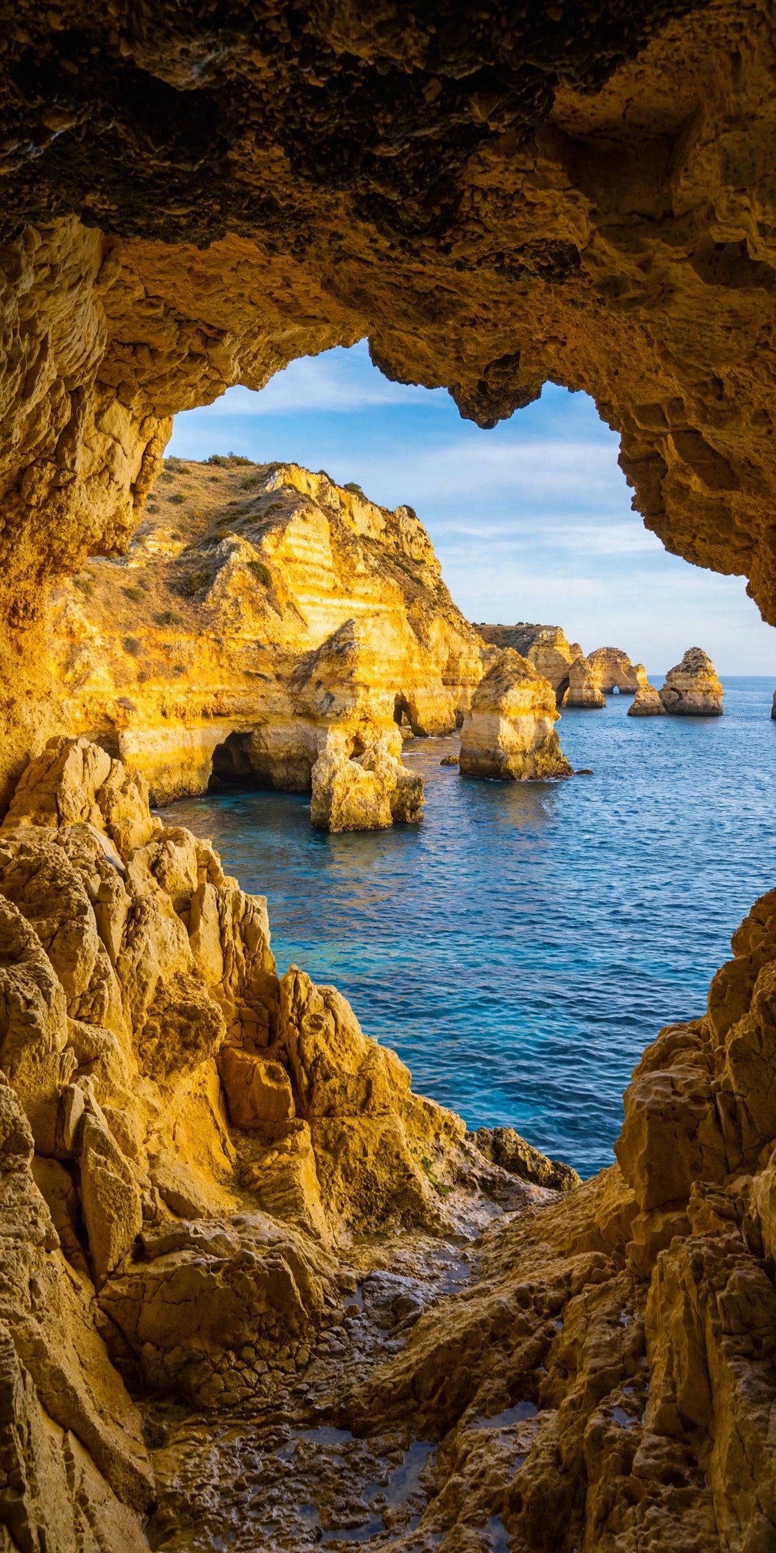 Golden cliffs and sea caves in Algarve Portugal
