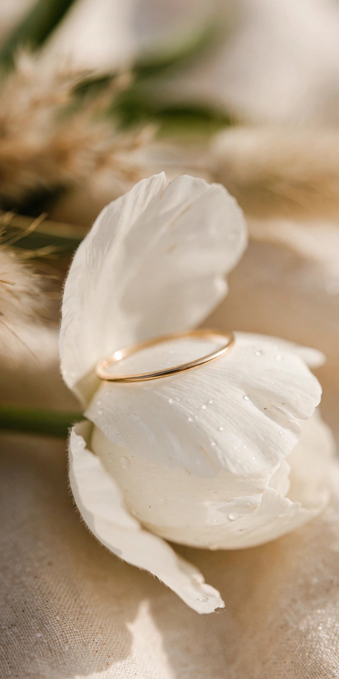 Thin Minimalist Band — wedding band in gold and platinum tones on a ring stand