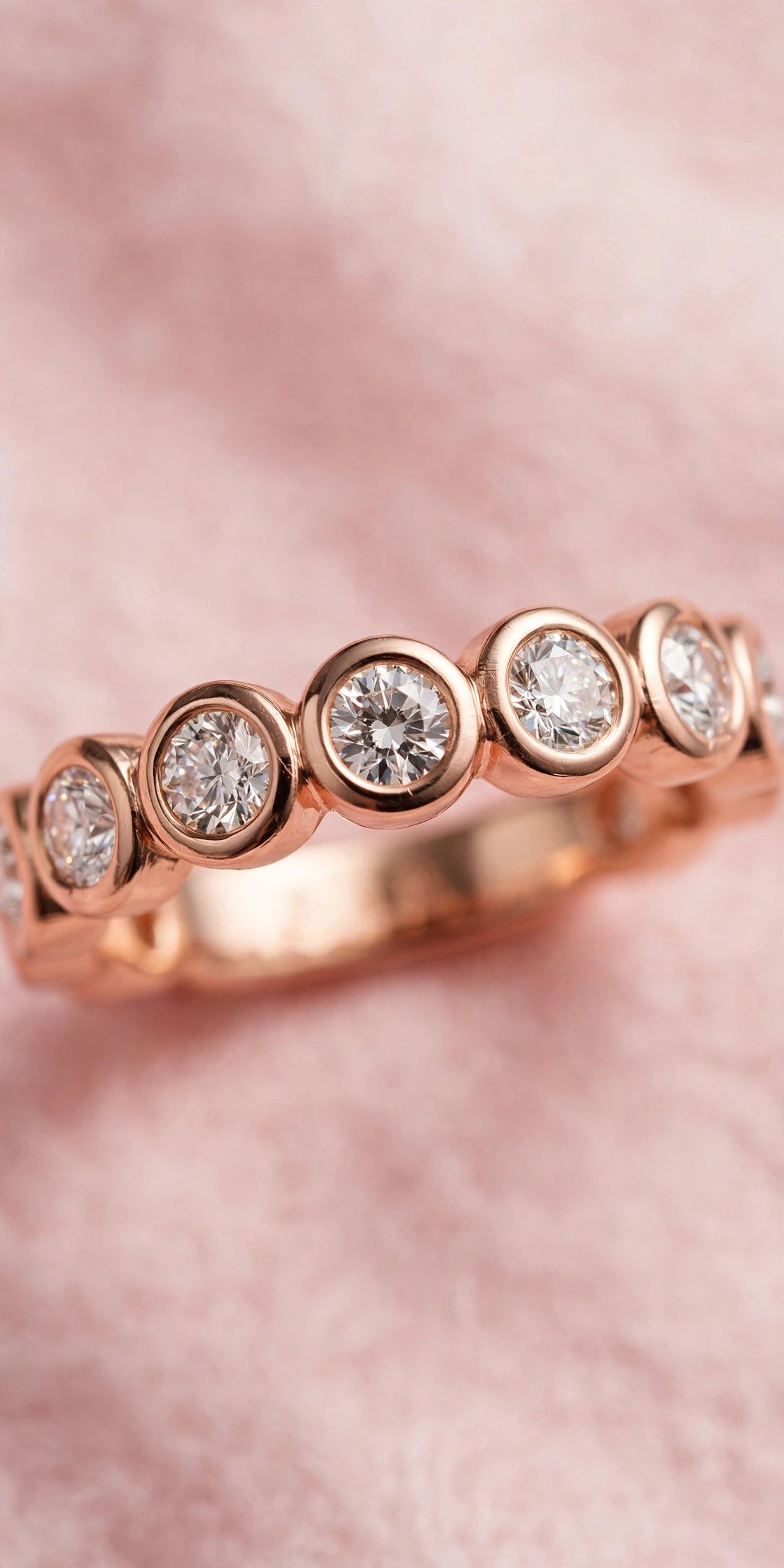 Rose Gold Bezel Band — rose gold wedding band on a soft pink background