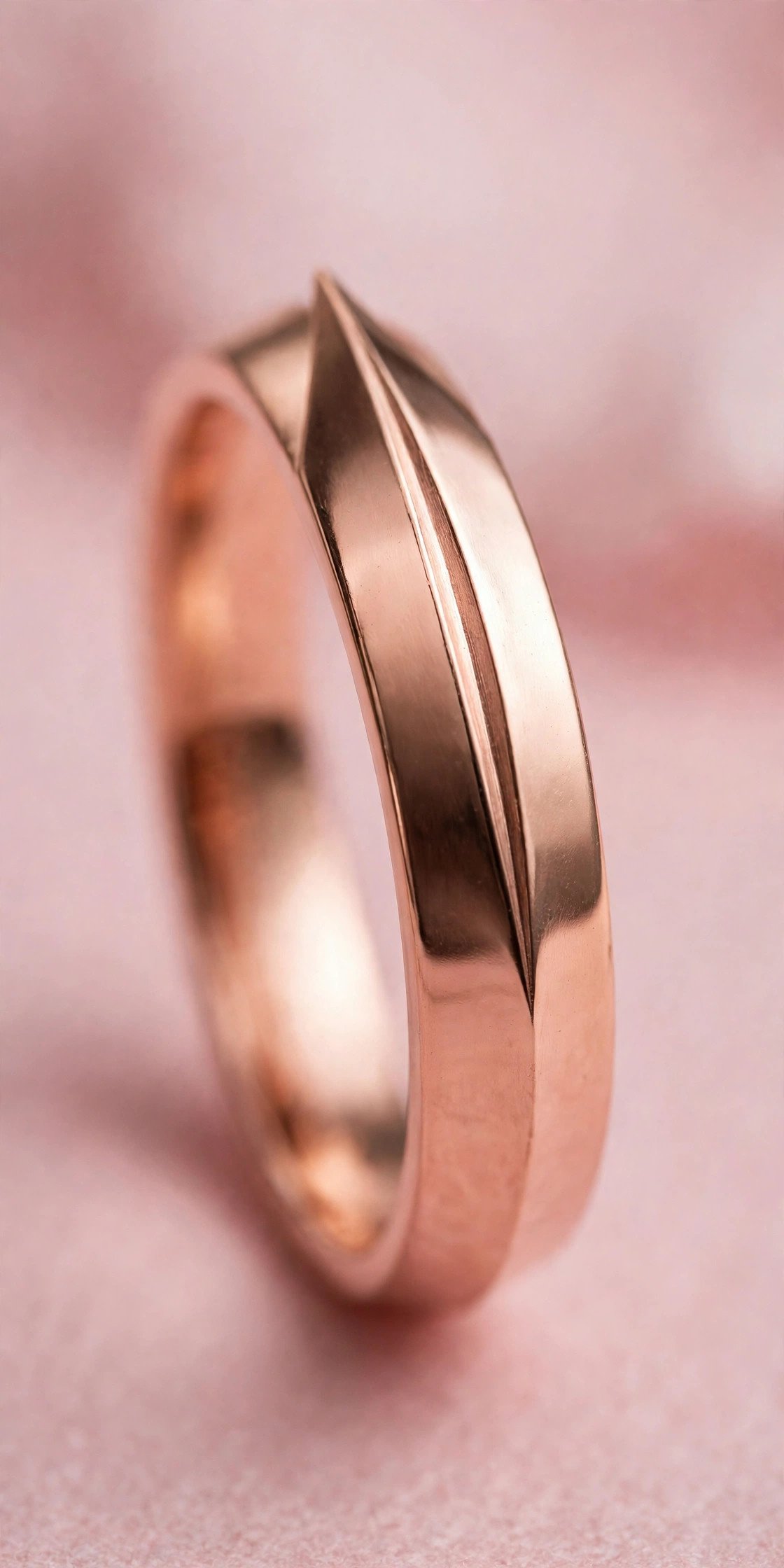 Rose Gold Knife-Edge Band — rose gold wedding band on a soft pink background