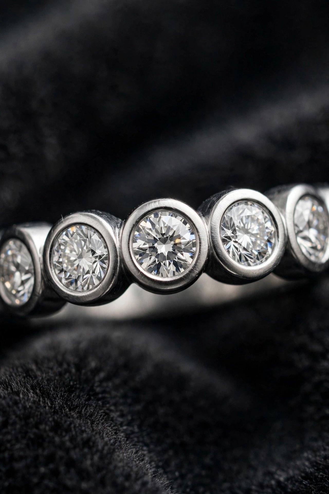 Bezel set lab diamond band with smooth metal rims