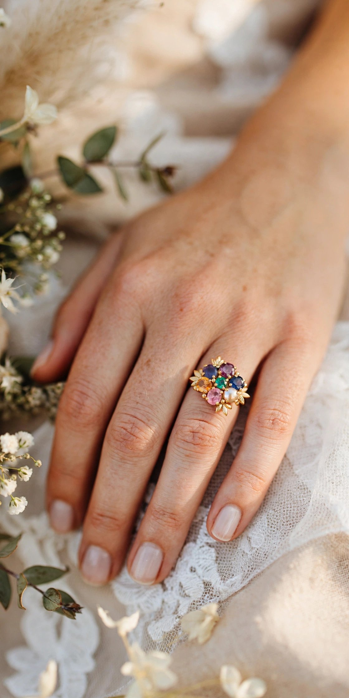 Family birthstone ring worn on the right hand