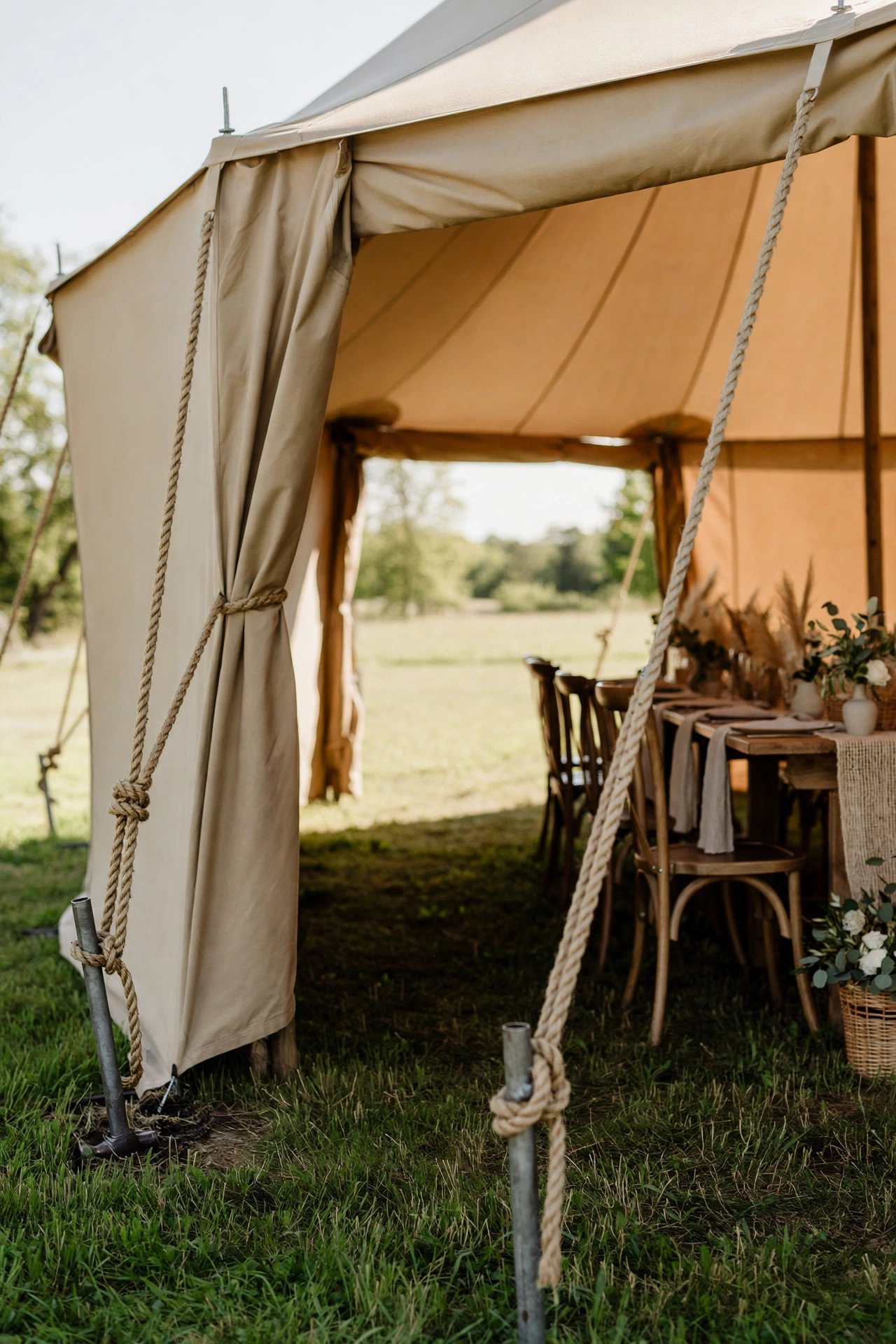 Safety: Stakes, Exits, and Fire Rules — explaining one part of planning a tented reception for a 2027 wedding