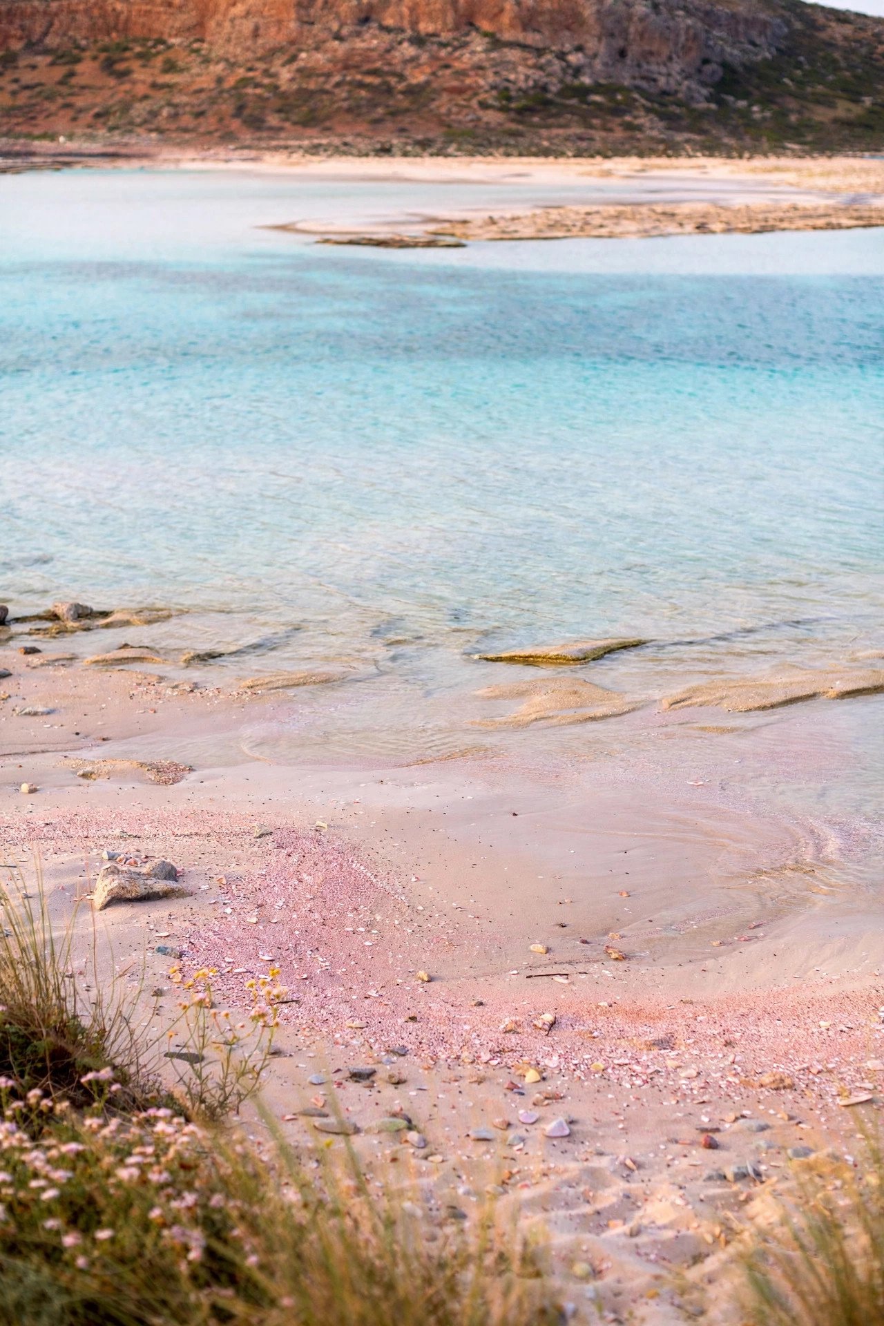 Pink-tinged sands and shallow turquoise lagoon at Balos beach on the island of Crete